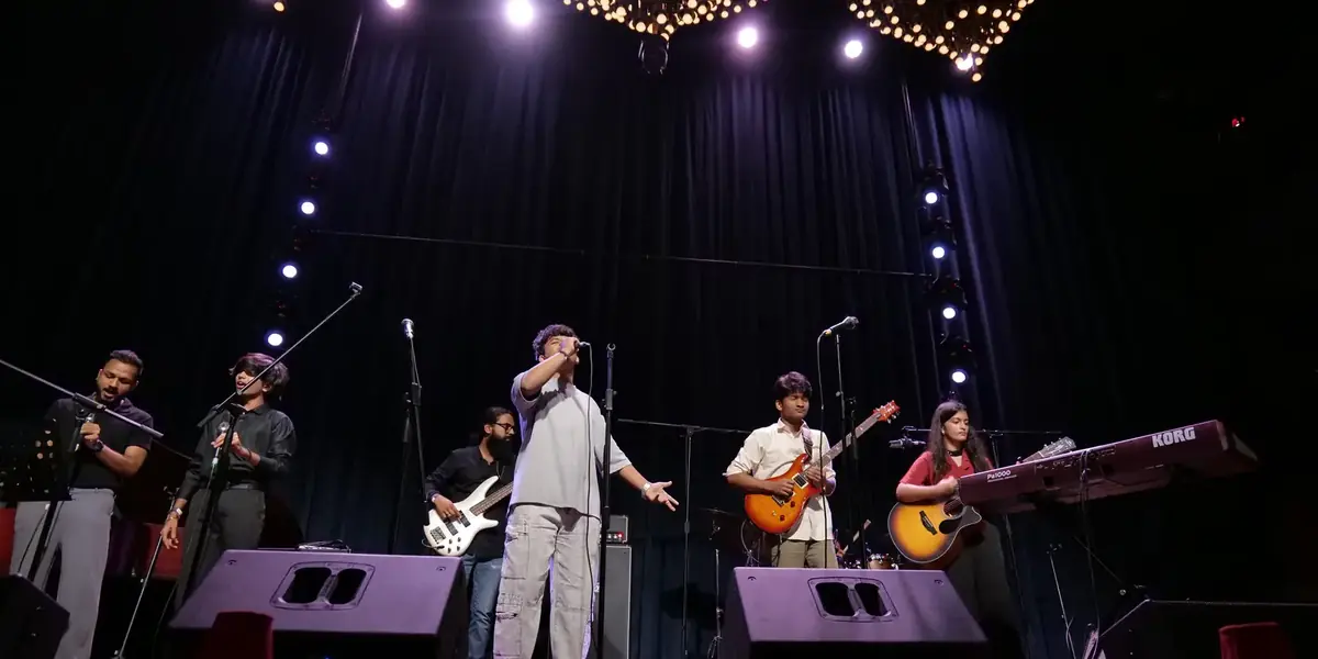 A band on stage at an OfMuziq Session